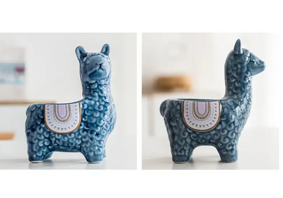 two ceramic llama plant pots