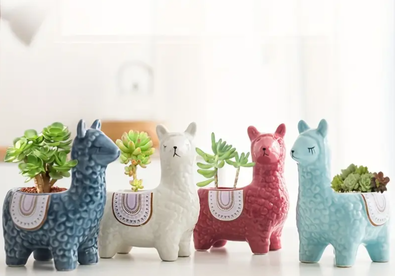 two ceramic llama plant pots