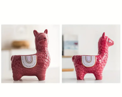 two ceramic llama plant pots